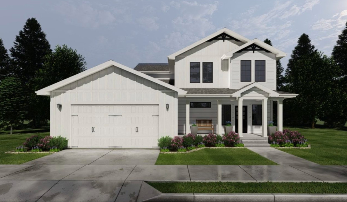 Beautiful modern white house with front porch and landscaped yard in High Springs.