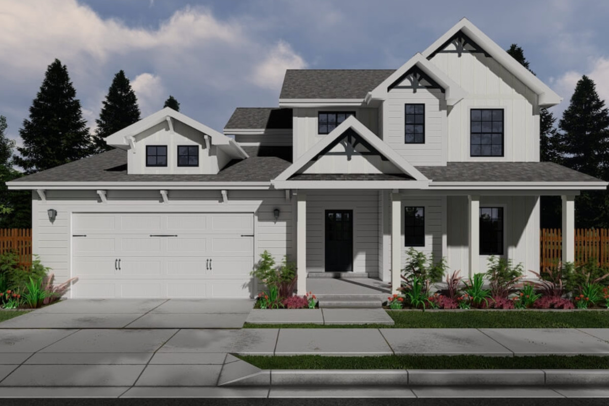 Beautiful modern white house with a landscaped front yard and a two-car garage.