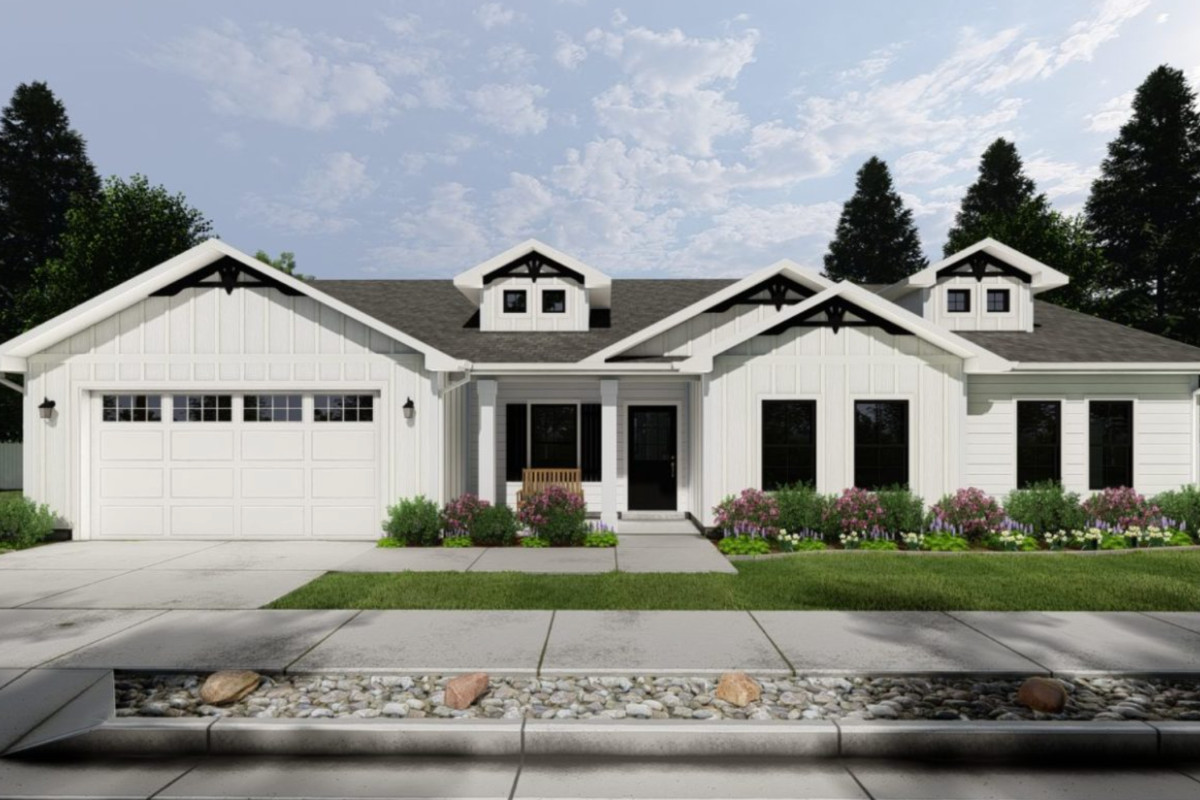 Kensington home featuring grand U-shaped staircase, gourmet kitchen with large island, open great room, and luxurious main-floor primary suite.