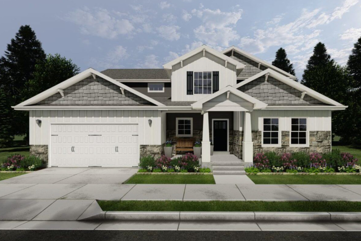 Ravenstone home featuring open family room with large windows, spacious island kitchen, and main-floor primary suite.