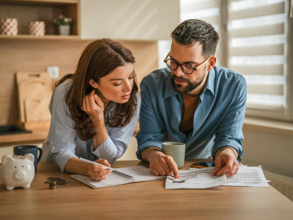 Family reviewing finances and home buying options while exploring homes for sale in High Springs Florida.
