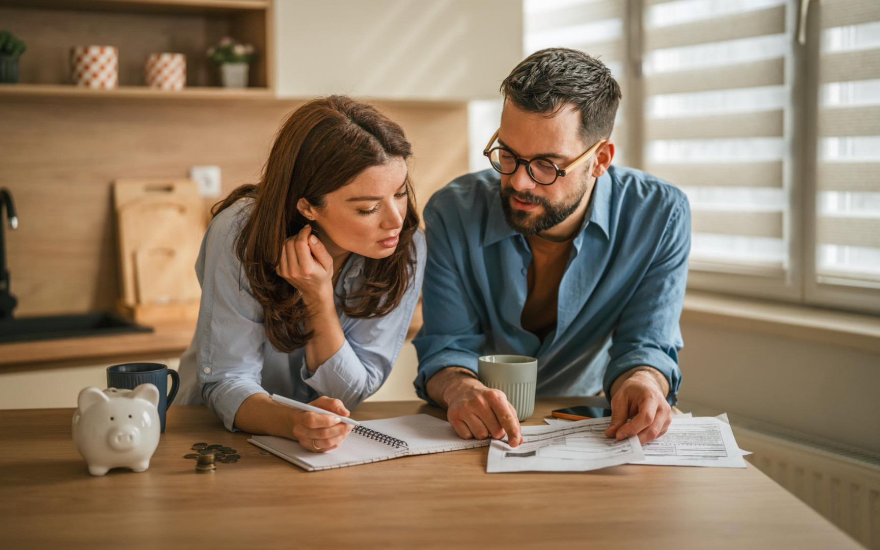 Family reviewing finances and home buying options while exploring homes for sale in High Springs Florida.