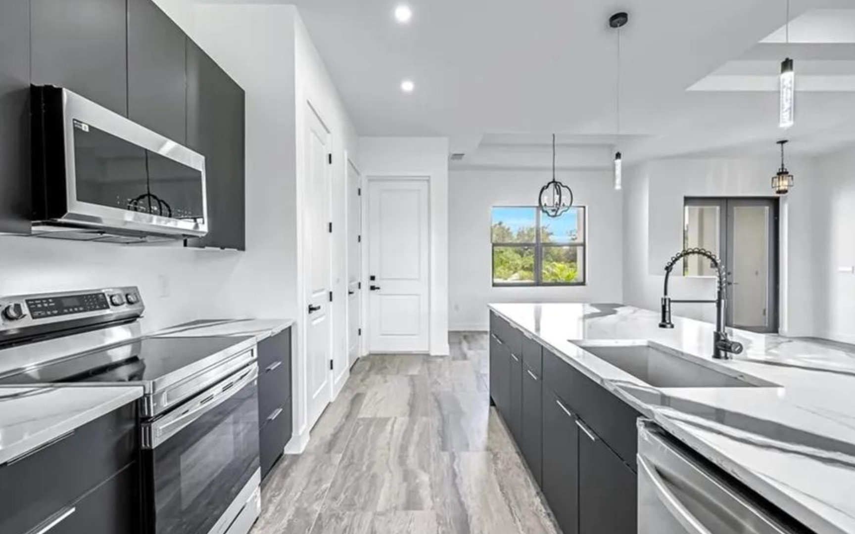 Modern open-concept interior showcasing the design, functionality, and features commonly found in new homes throughout Florida.